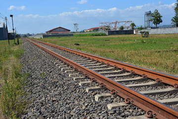Fototapeta na wymiar railway line in rice fields
