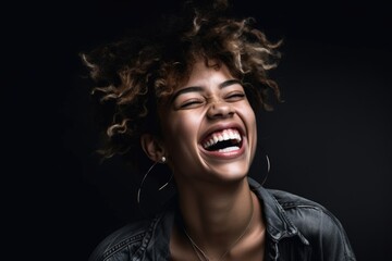 shot of a young woman having fun in front of a grey background