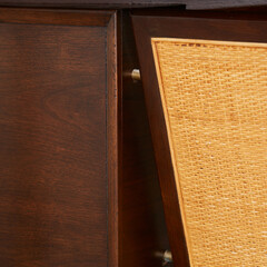 Dark walnut vintage floating top desk. Danish modern furniture. Close-up detail product photograph.