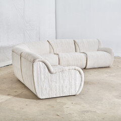 Vintage 1980s white sectional sofa. Textured upholstery furniture. Interior product photograph.
