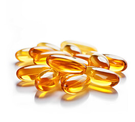 Golden vitamin capsules on a white background