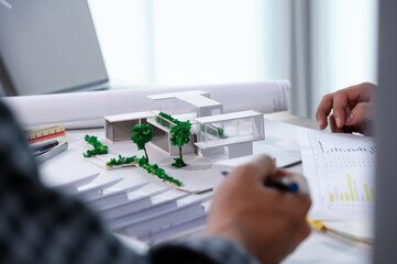 Paper Model of Modern House Miniature Sample of Architect Student on Table While Discussion and...