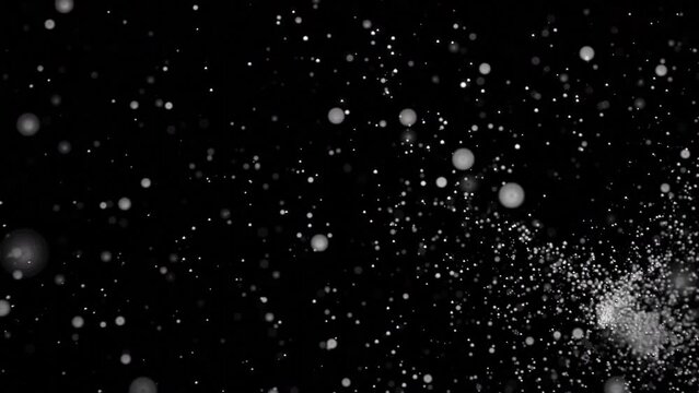 Background of fast moving dots in storm. Design. A lot of points are moving in fast random flow. Storm of colored dots on black background