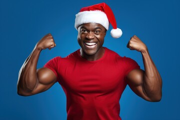 Fototapeta premium Beautiful dark-skinned Santa Claus on a blue background.