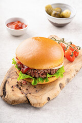 Beef burger on wooden plate