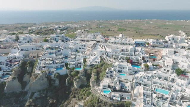 Luxury hotels adorn Santorini's sun-soaked shores.