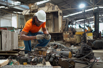 Professional electric engineer or repairman inspecting a broken electrical circuit board or fuse board in the factory, a maintenance engineer repairing a fuse box and electrical circuit.