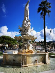 Photo of a beautiful fountain with a majestic statue at its center