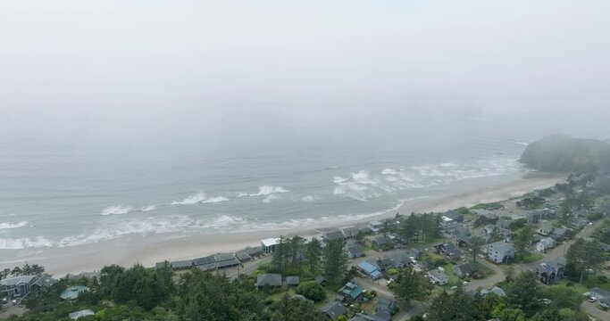 Drone's lens pierces coastal Oregon's foggy veil.