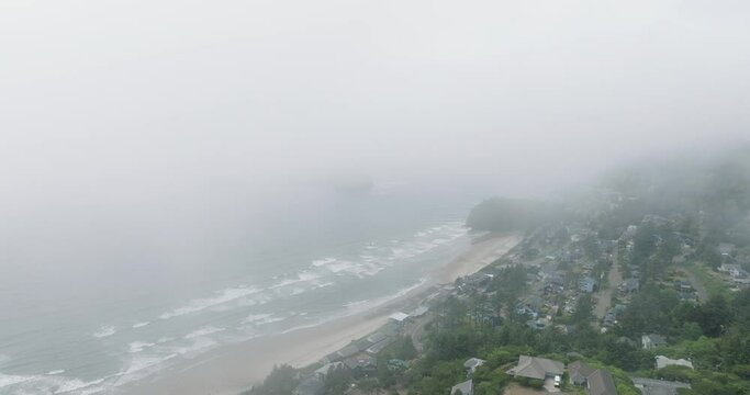 Coastal charm shrouded in mist, drone captures magic.
