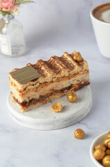 Caramel and Hazelnut Cake, Dacquoise Cake on Bright Background
