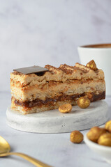 Caramel and Hazelnut Cake, Dacquoise Cake on Bright Background