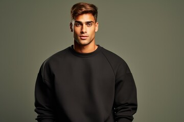 Fototapeta premium Portrait of a Fictional Model Wearing a Large Oversized Plain Sweatshirt Isolated on a Colored Blank Background. Generative AI.