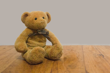 Teddy bear on a wooden background
