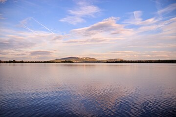 Oncoming sunset above the lake near Palava hills at South Moravia, Czech republic