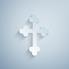 Paper cut Christian cross icon isolated on grey background. Church cross. Paper art style. Vector