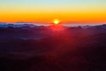 Fototapeta na wymiar Beautiful sunrise on a top of Mount Sinai (Moses Mount) in Egypt