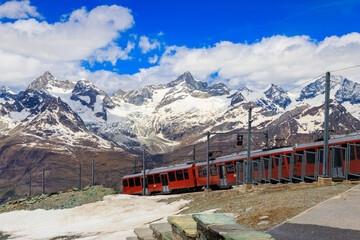 Beautiful view of the Swiss Alps with cogwheel train of Gornergrat railway close to Zermatt, Switzerland