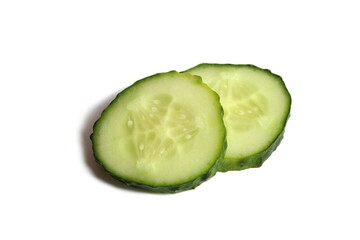 Two slices of sliced cucumber lie on a white background.