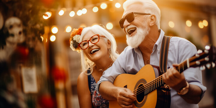 Active senior couple singing and playing musical instruments together - Powered by Adobe