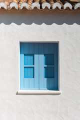 Traditional Wooden Window with tile roof and white wall