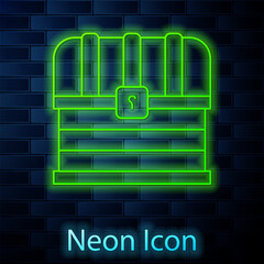 Glowing neon line Antique treasure chest icon isolated on brick wall background. Vintage wooden chest with golden coin. Vector
