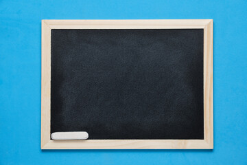 Chalkboard with chalk on bright blue background.