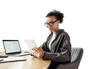 The designer is a young female student using a tablet and a laptop computer, laughing while working online. An office employee, a young entrepreneur in the office.