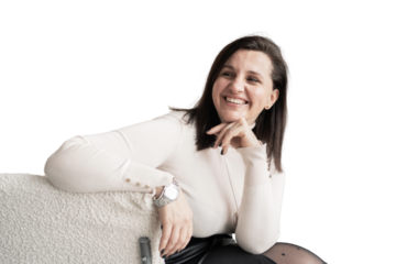 The designer is a young woman laughing and looking away. An office employee, a young entrepreneur in the office.