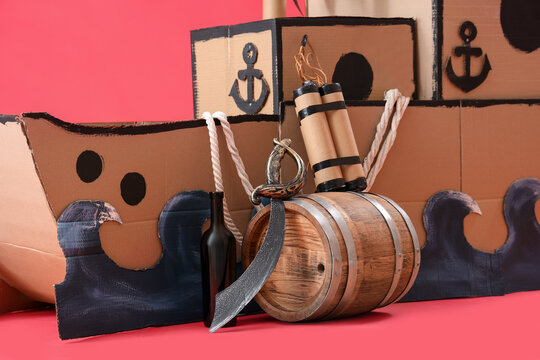 Pirate cardboard ship with explosive on red background