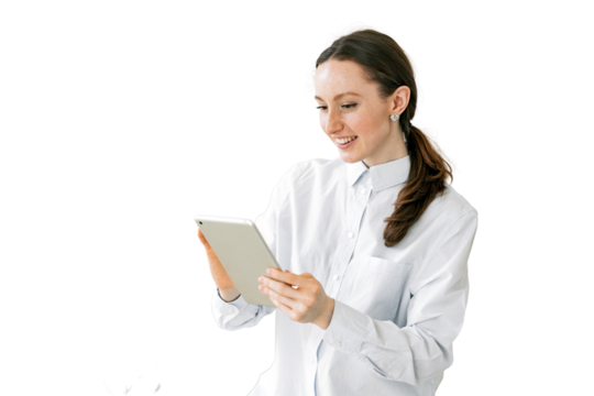 A business woman uses a tablet to write a message, a secretary is a workplace in the office. An office employee is a financier in modern clothes. Video call online.