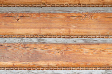 Wooden background, close-up of a log house with knots and nail holes. Wood background