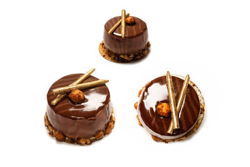 Chocolate and caramel cake isolated on a white background.