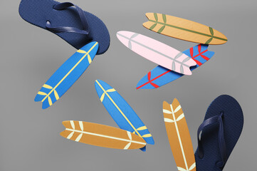 Flying mini surfboards and flip-flops on grey background