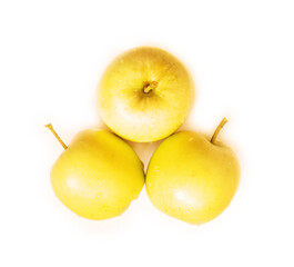 wet golden apples isolated on white