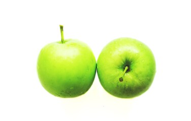 2 wet green apples isolated
