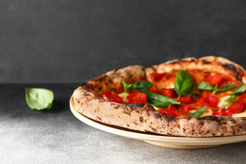 Plate with tasty pizza Margarita on table