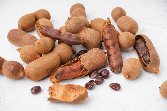 Heap of tasty tamarinds on white background