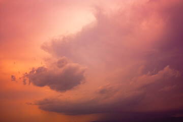 Naklejka na ściany i meble Photo of rainy clouds and pink sky.