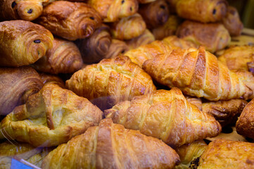 Butter puff croissants on display in artisanal bakery in Paris, France