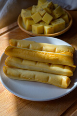 Cheese collection, Italian yellow smoked caciocavallo or scamorza cheese sticks from Puglia