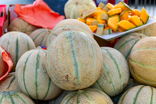 Yellow honey from Cavaillon, ripe round charentais honey cantaloupe melons on local market in Provence, France