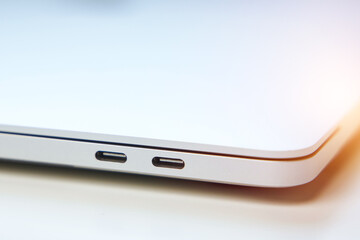 High-Performance Laptop USB-C Ports: Versatile Connectivity for Modern Computing. Thunderbolt 4, Headphone Jack, Side View Isolated on White Office Background