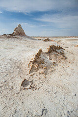 Hills of chalk and limestone and slopes of multi-colored mountains with weathering and washouts from water, colored relief in the steppe