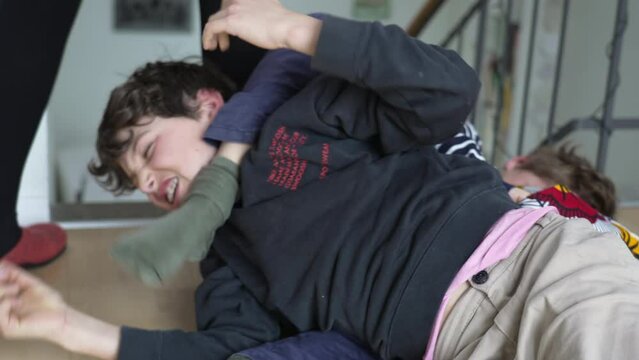 Family Feud - Brothers on Floor in Heated Wrestling Match. Indoor Sibling FIGHT - Brothers Wrestling and Quarreling on Floor