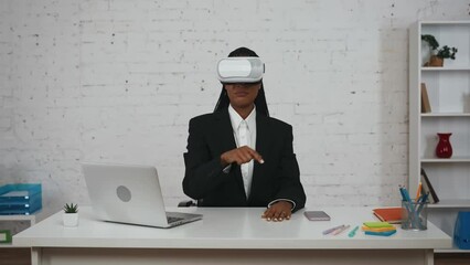Modern businesswoman creative concept. Woman wearing vr glasses, moving hands, swiping, scrolling through virtual office app, zooming pictures. - Powered by Adobe