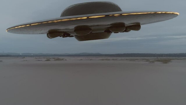 Giant flying saucer landing in the desert. UFO, UAP. High quality cinematic sci-fi film video footage. Alien spaceship. Vintage science-fiction. Alien invasion concept. Part 3 of 3. 