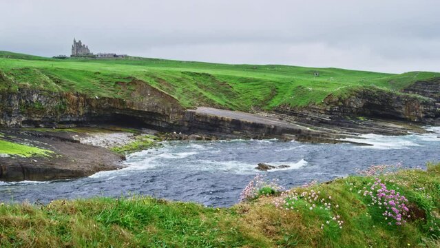 Classiebawn Castle with ocean shore