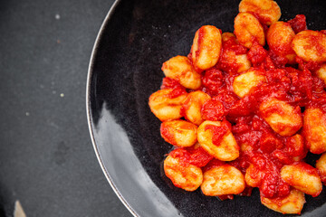 gnocchi delicious potato dish tomato sauce no meat ready meal appetizer meal food snack on the table copy space food background rustic top view vegetarian vegan food  