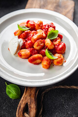 gnocchi delicious potato dish tomato sauce no meat ready meal appetizer meal food snack on the table copy space food background rustic top view vegetarian vegan food  